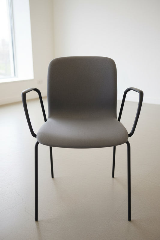 Gray chair with black metal arms and legs in a room setting